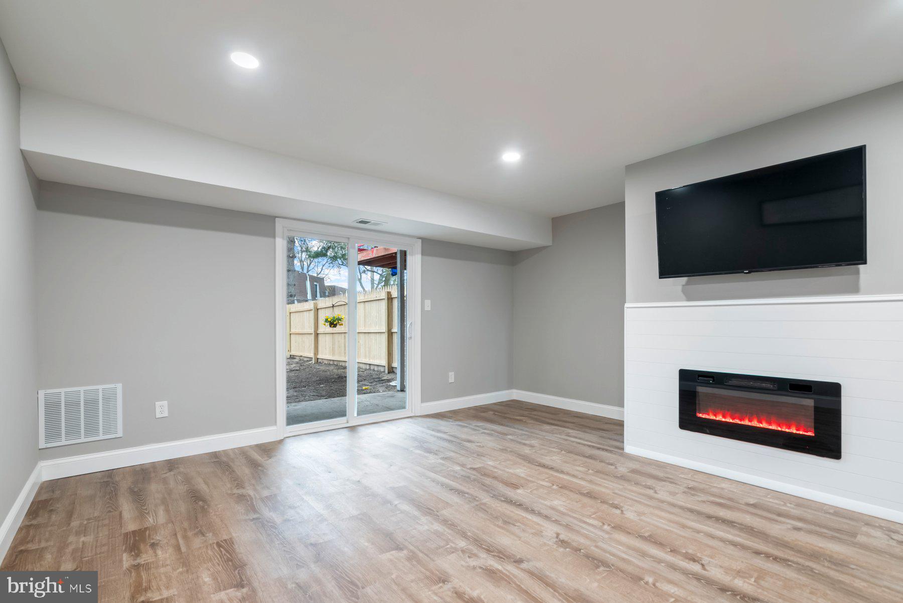 261 Via Cascata Drive Clementon, NJ 08021 - Photo 11 of 26 a view of a livingroom with an empty space and a fireplace
