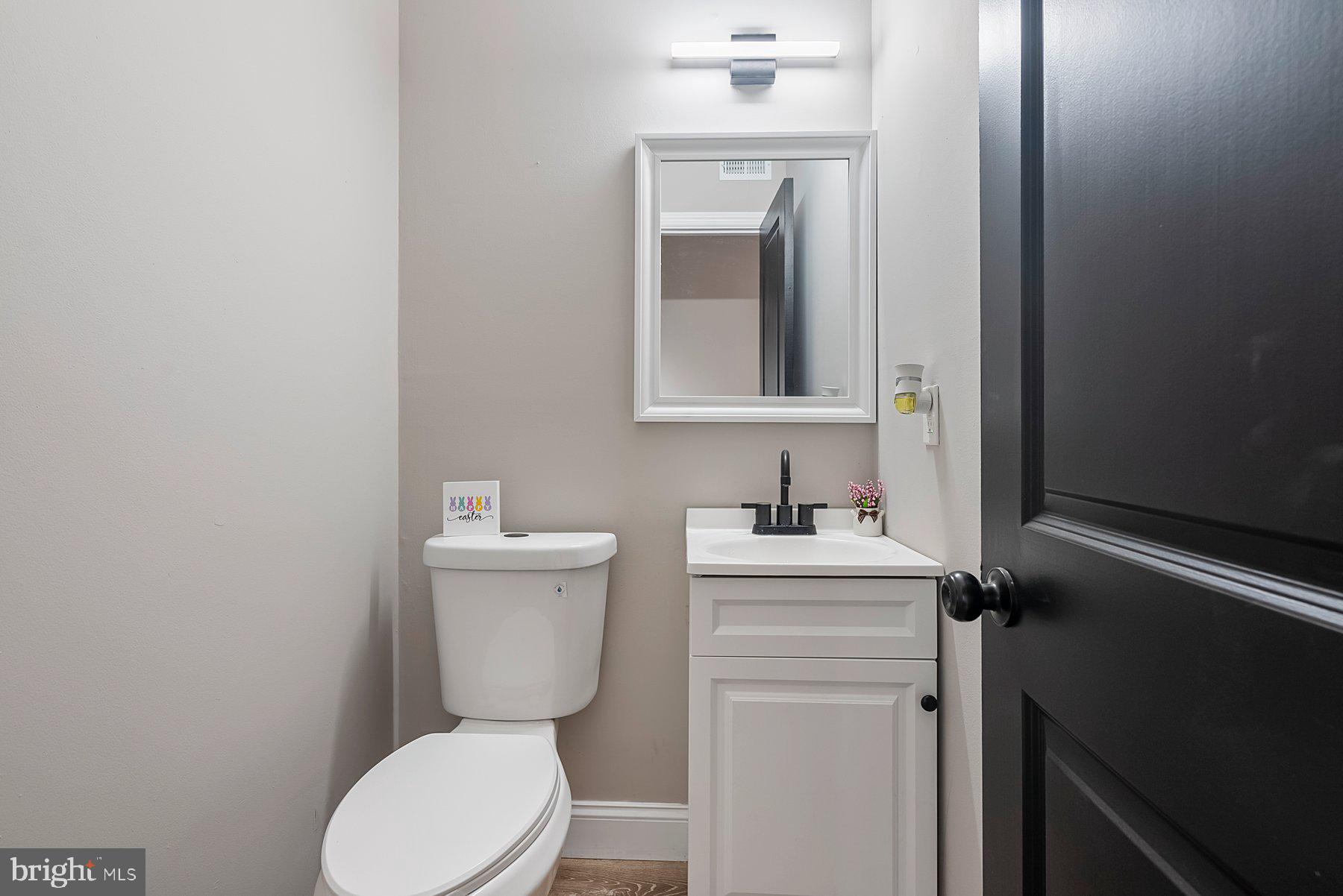 261 Via Cascata Drive Clementon, NJ 08021 - Photo 12 of 26 a bathroom with a toilet a sink and mirror