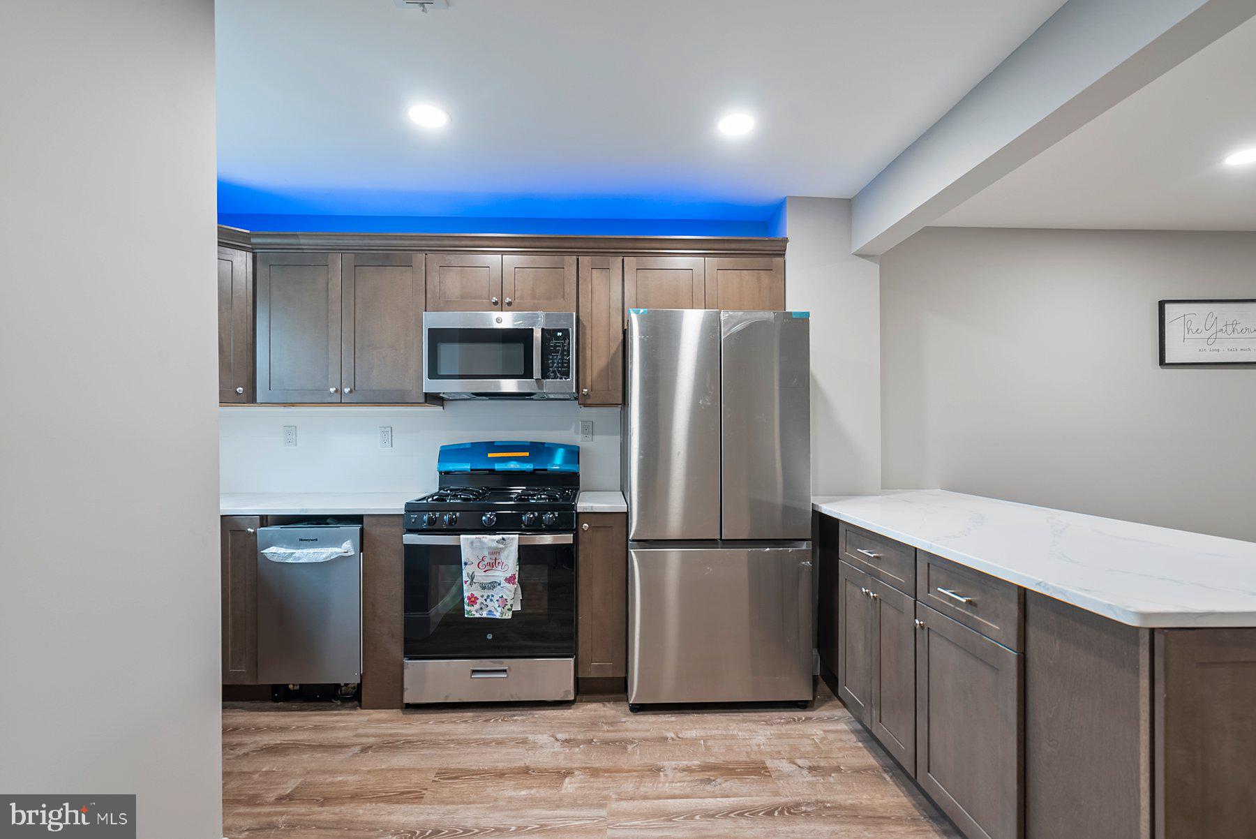 261 Via Cascata Drive Clementon, NJ 08021 - Photo 3 of 26 a kitchen with stainless steel appliances granite countertop a refrigerator a stove and a microwave