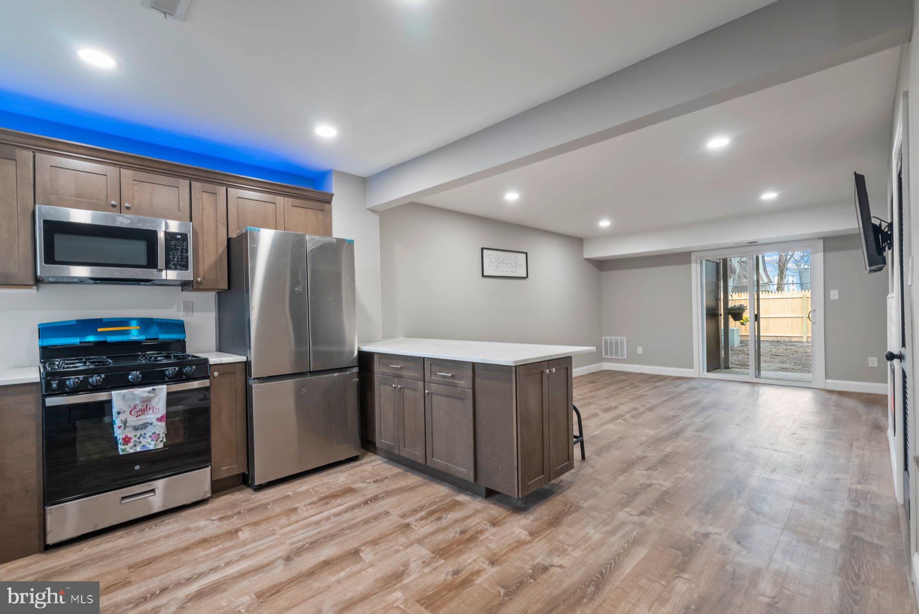 261 Via Cascata Drive Clementon, NJ 08021 - Photo 4 of 26 a kitchen with stainless steel appliances a refrigerator stove and microwave