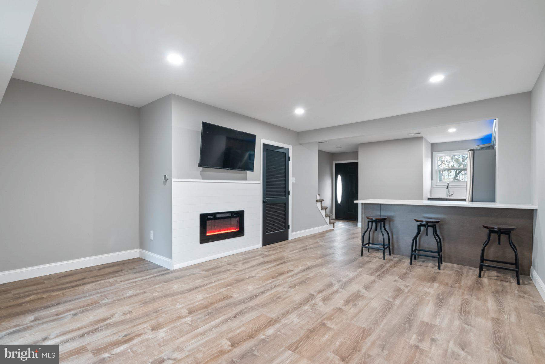 261 Via Cascata Drive Clementon, NJ 08021 - Photo 9 of 26 a view of a livingroom with furniture fireplace and a window