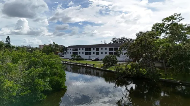 a view of a lake with a building in the background