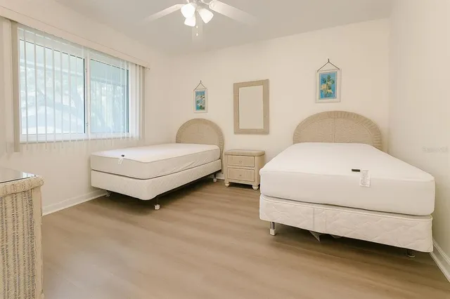 a spacious bedroom with a bed and a couch