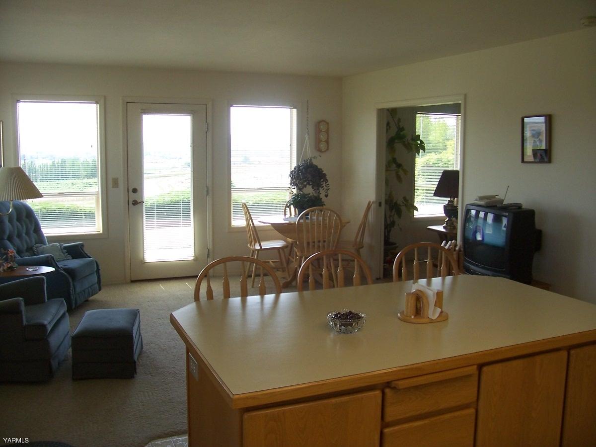 140 Faucher Road Yakima, WA 98901 - Photo 5 of 13 a view of a dining room with furniture and window