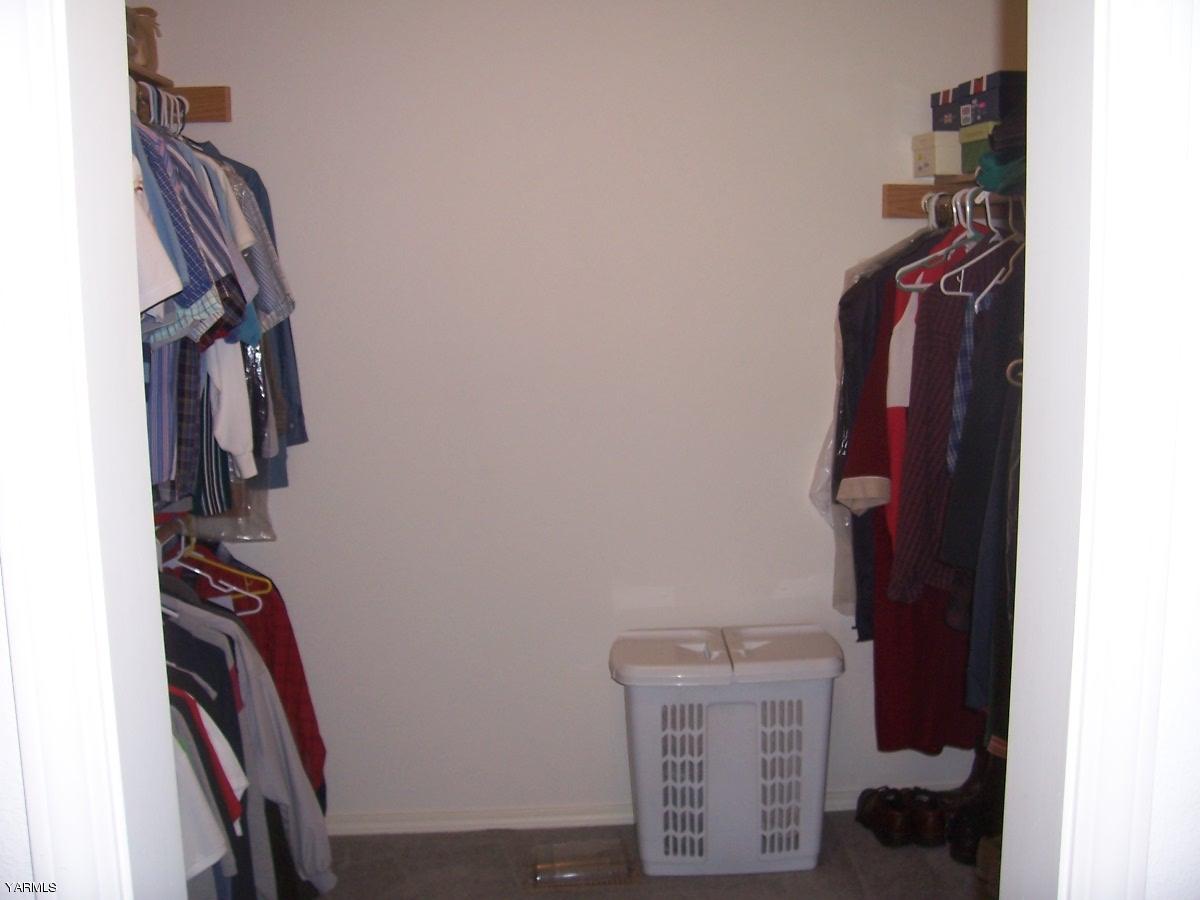 140 Faucher Road Yakima, WA 98901 - Photo 8 of 13 a view of walk in closet with clothes and shoes