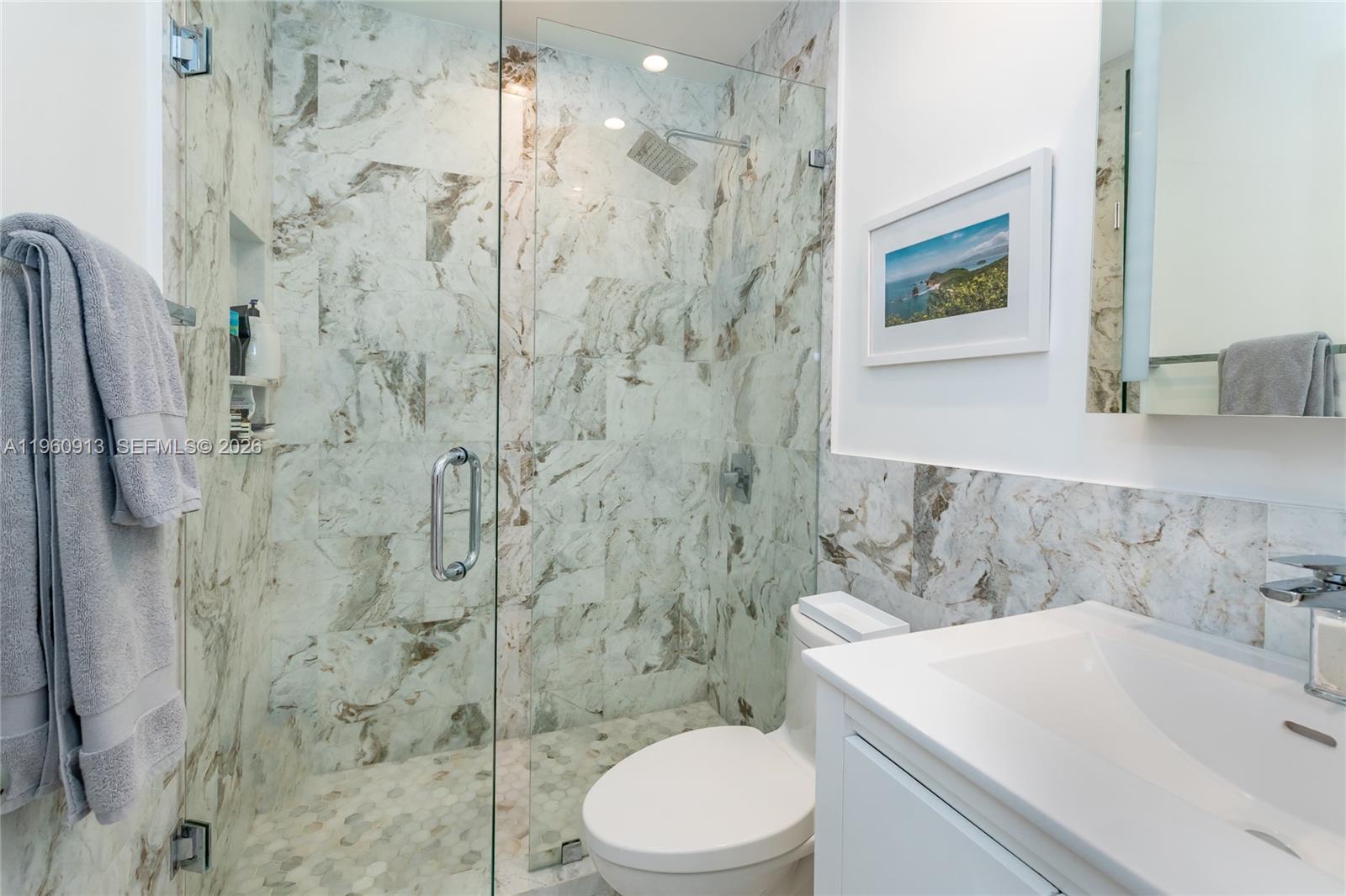 2451 Brickell Avenue, Unit 10K Miami, FL 33129 - Photo 13 of 25 a bathroom with a sink toilet and shower