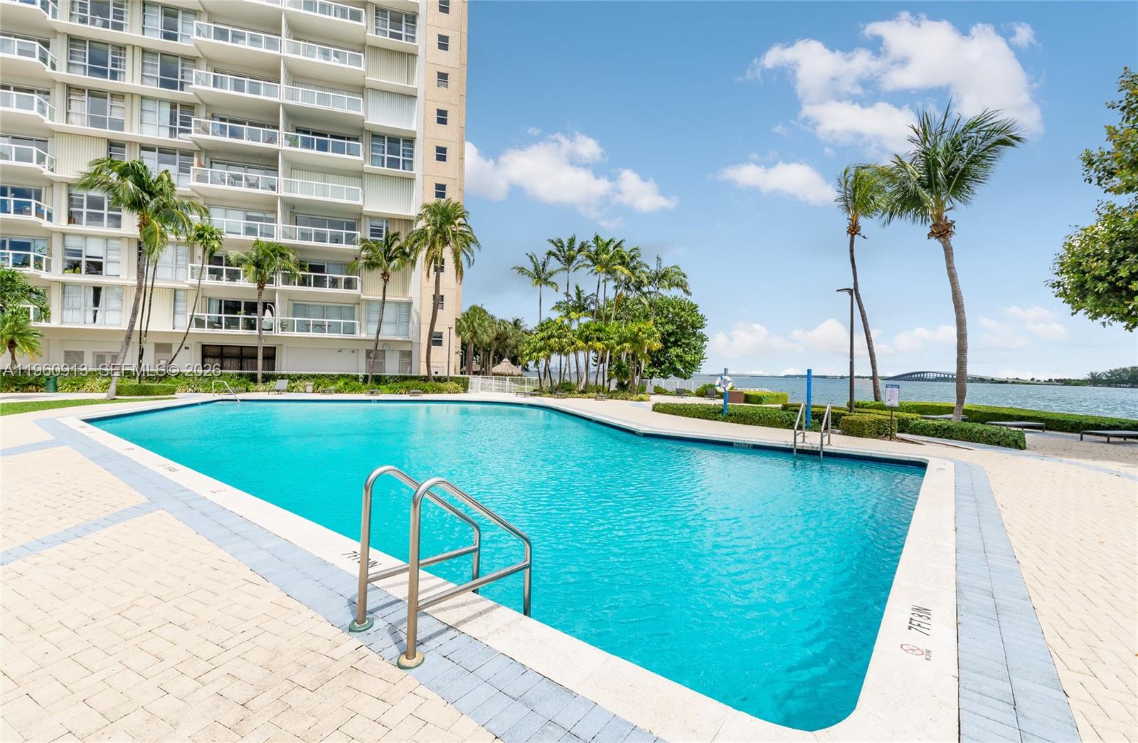 2451 Brickell Avenue, Unit 10K Miami, FL 33129 - Photo 19 of 25 a view of swimming pool with outdoor seating and plants