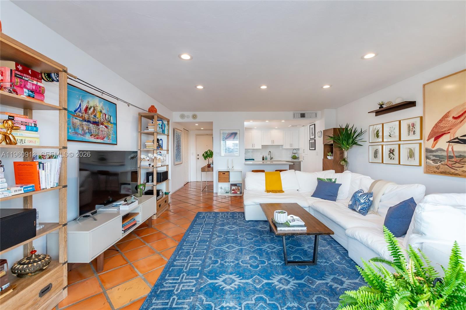 2451 Brickell Avenue, Unit 10K Miami, FL 33129 - Photo 8 of 25 a living room with furniture and a flat screen tv