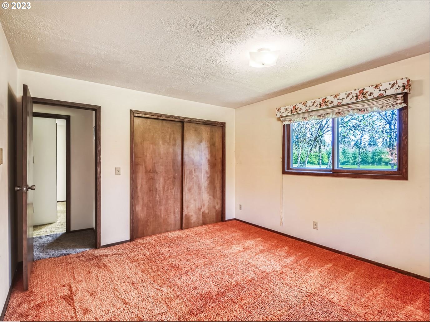 18331 Northwest Reeder Road Portland, OR 97231 - Photo 22 of 46 a view of an empty room with a window