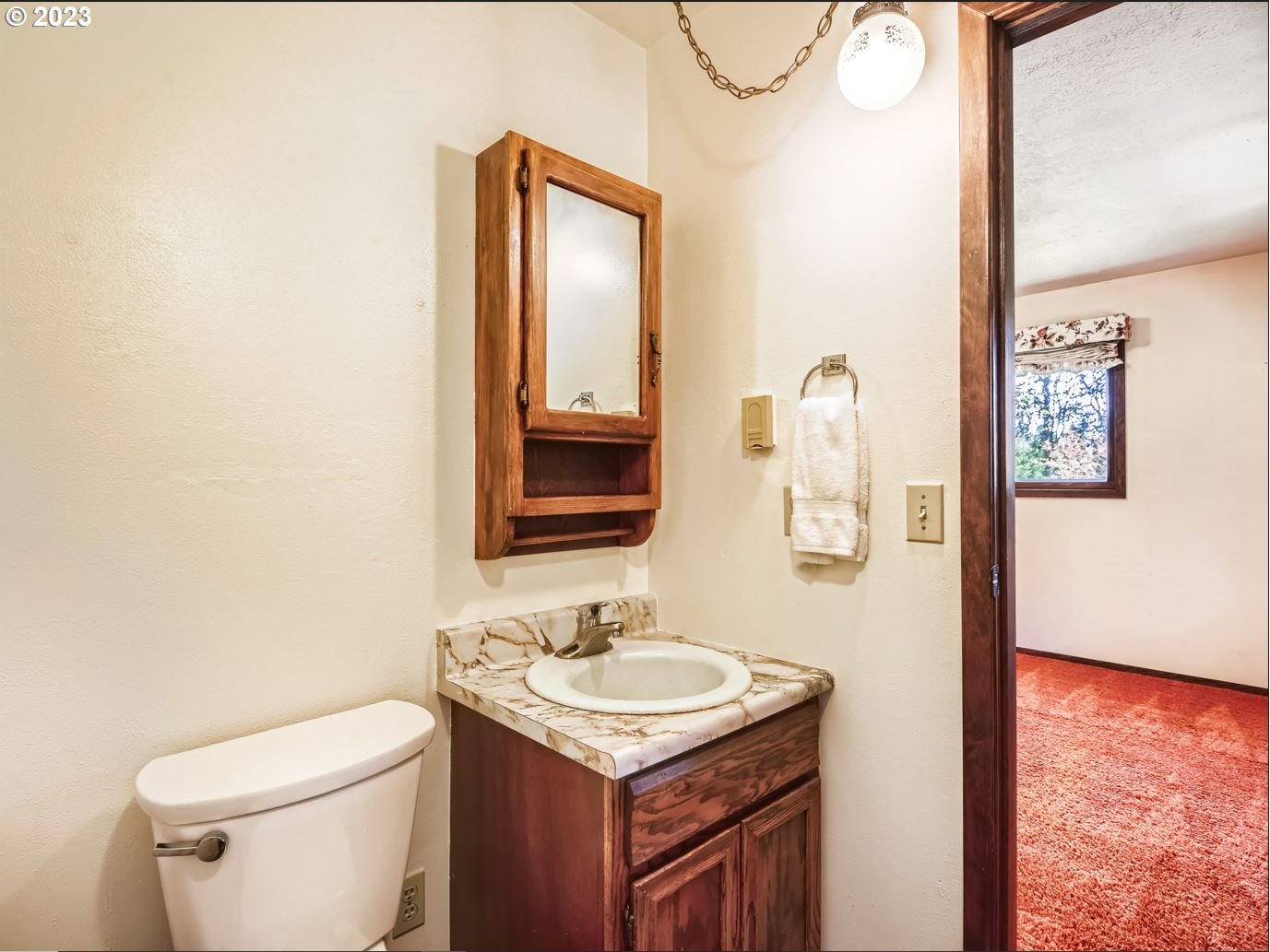 18331 Northwest Reeder Road Portland, OR 97231 - Photo 24 of 46 a bathroom with a granite countertop sink toilet and mirror