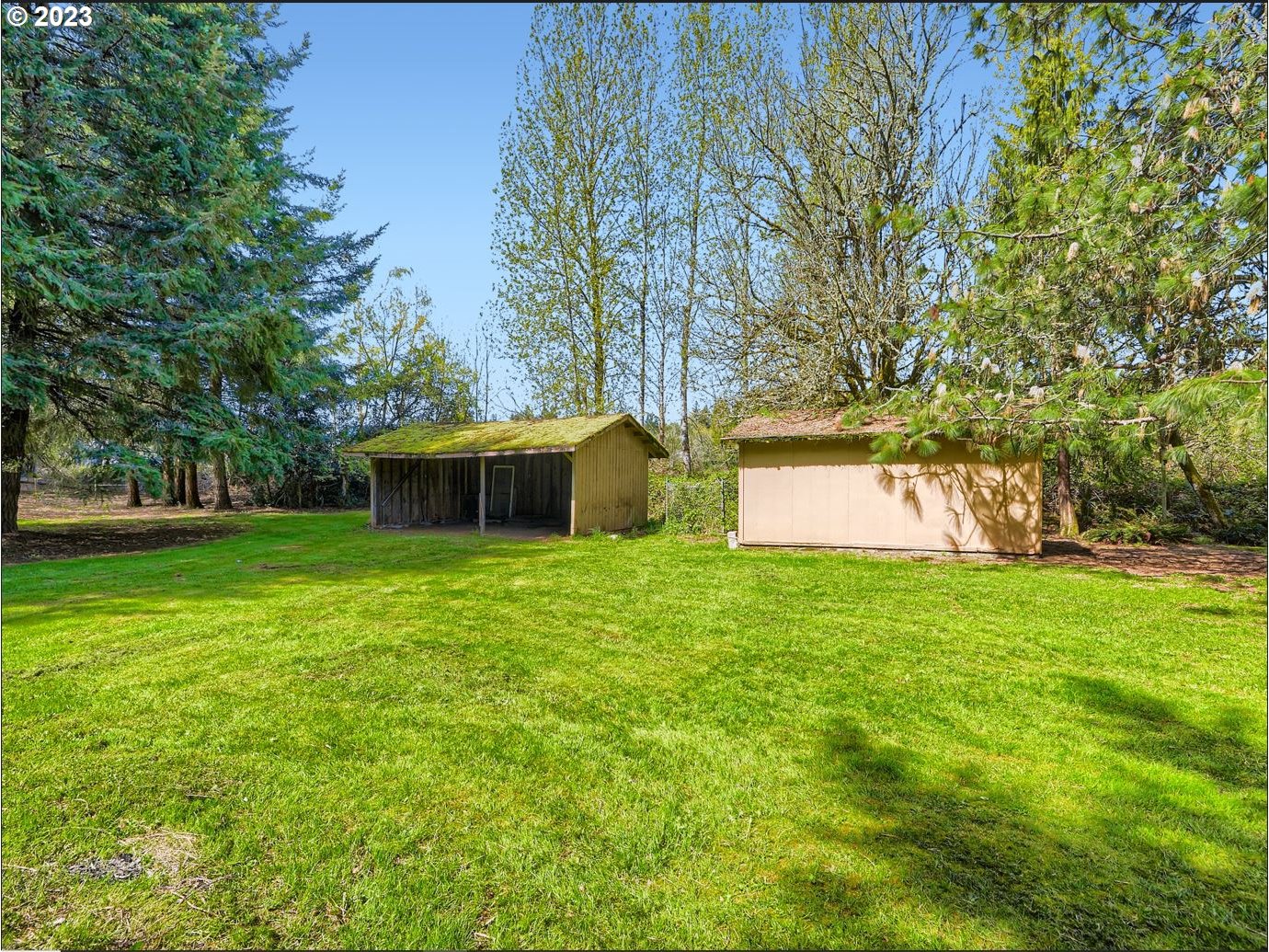 18331 Northwest Reeder Road Portland, OR 97231 - Photo 39 of 46 a view of a house with a yard