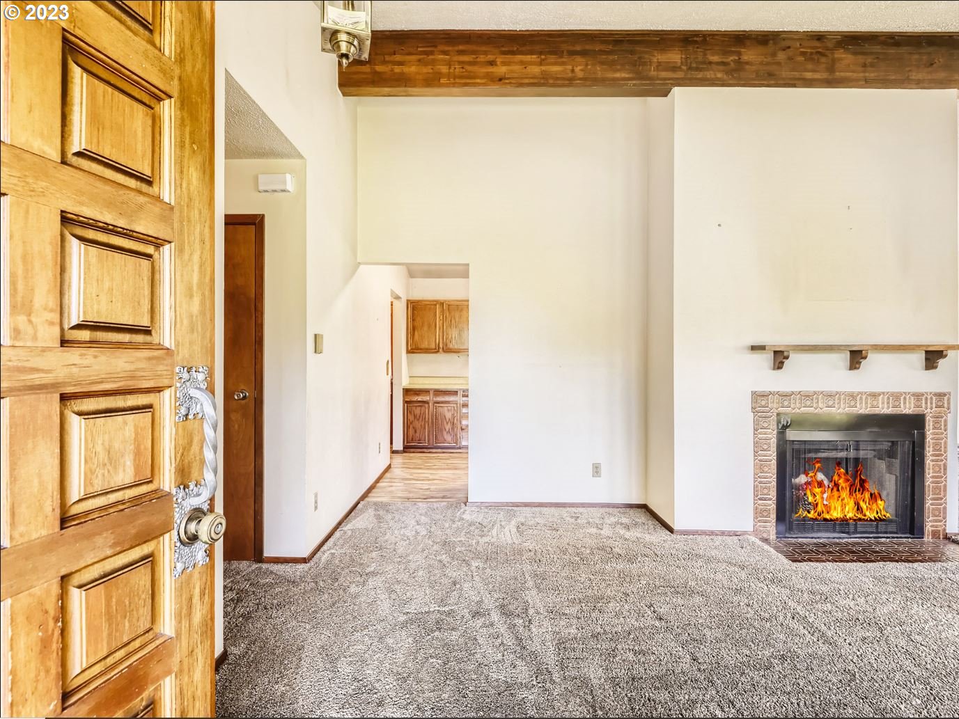 18331 Northwest Reeder Road Portland, OR 97231 - Photo 10 of 46 a view of an empty room with a fireplace and a window