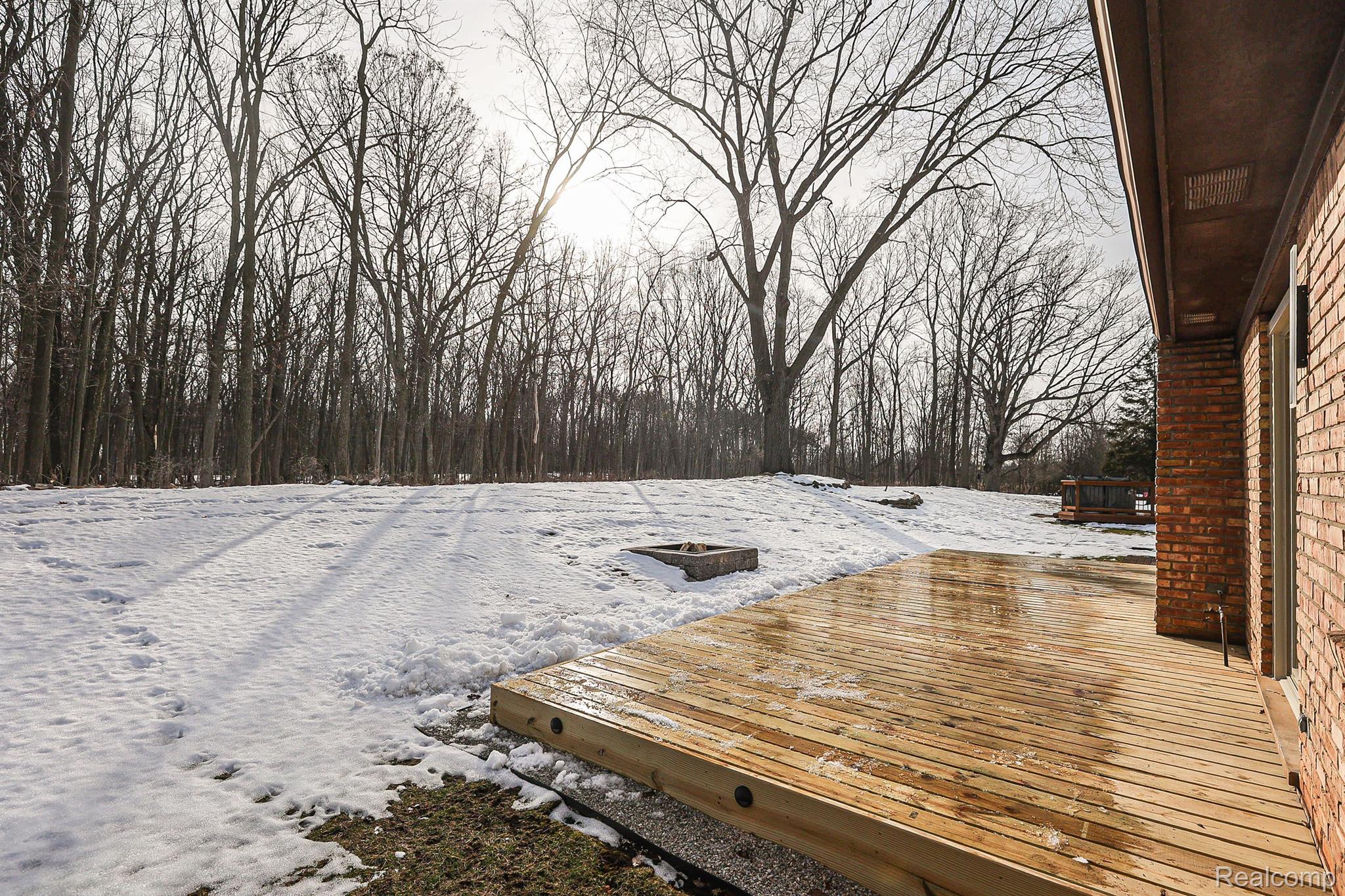 763 Snowmass Drive Rochester, MI 48309 - Photo 28 of 32 Backyard backs up to the woods