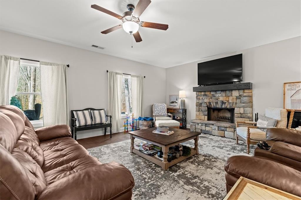 14 Cambridge Lane Bremen, GA 30110 - Photo 21 of 51 a living room with furniture a flat screen tv and a fireplace