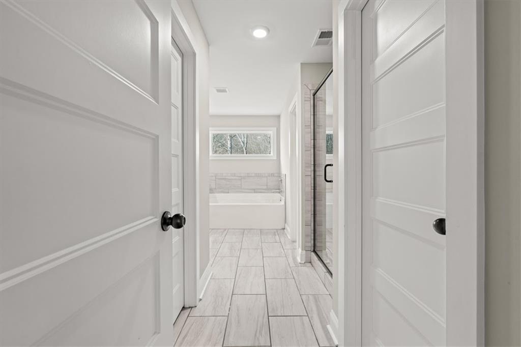 14 Cambridge Lane Bremen, GA 30110 - Photo 25 of 51 a bathroom with a shower and a glass door