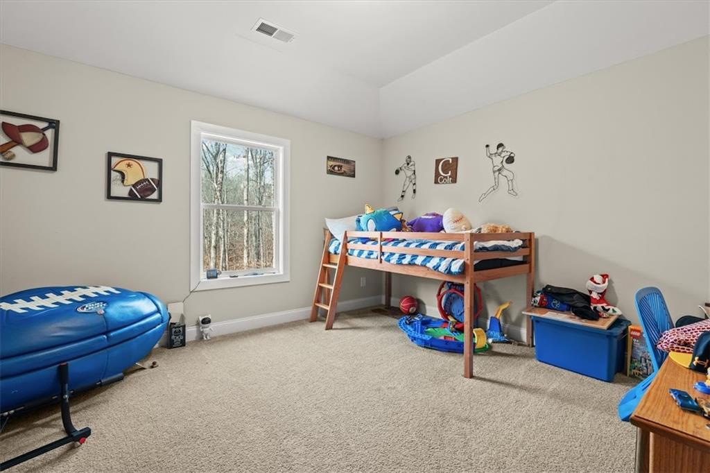 14 Cambridge Lane Bremen, GA 30110 - Photo 30 of 51 a bedroom with furniture and a baby crib