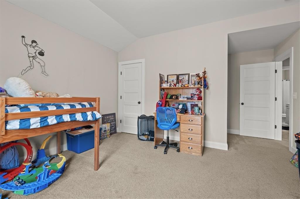 14 Cambridge Lane Bremen, GA 30110 - Photo 31 of 51 a view of a bedroom with baby crib and furniture