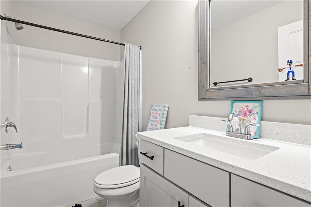 14 Cambridge Lane Bremen, GA 30110 - Photo 33 of 51 a bathroom with a sink toilet vanity and shower