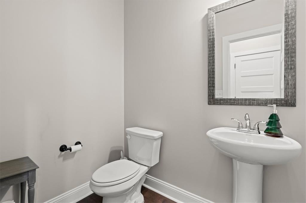 14 Cambridge Lane Bremen, GA 30110 - Photo 34 of 51 a bathroom with a toilet a sink and mirror