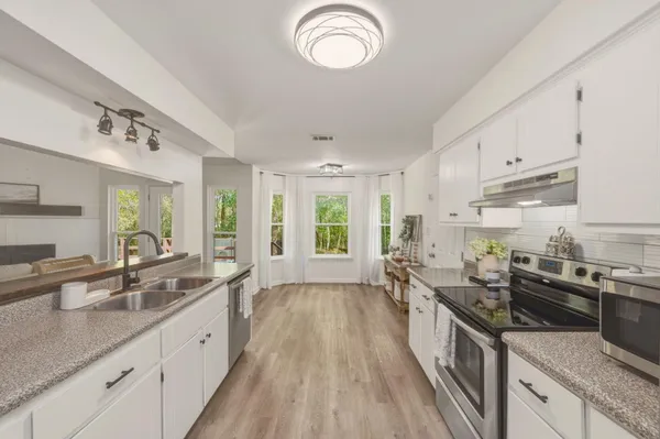a large kitchen with cabinets