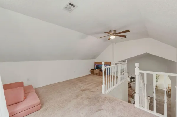 a view of a livingroom with a ceiling fan