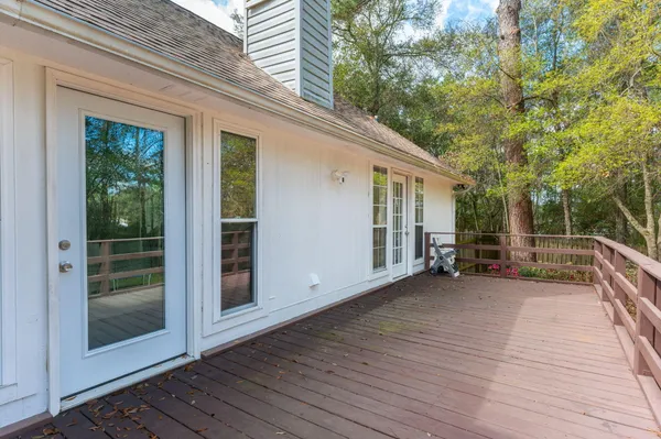 a view of backyard with deck and backyard