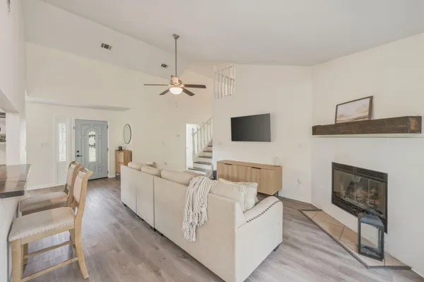 a living room with furniture and a fireplace