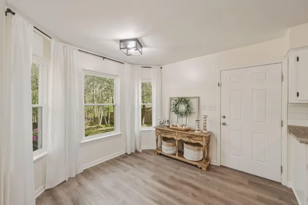 a room that has a bed and a window in it