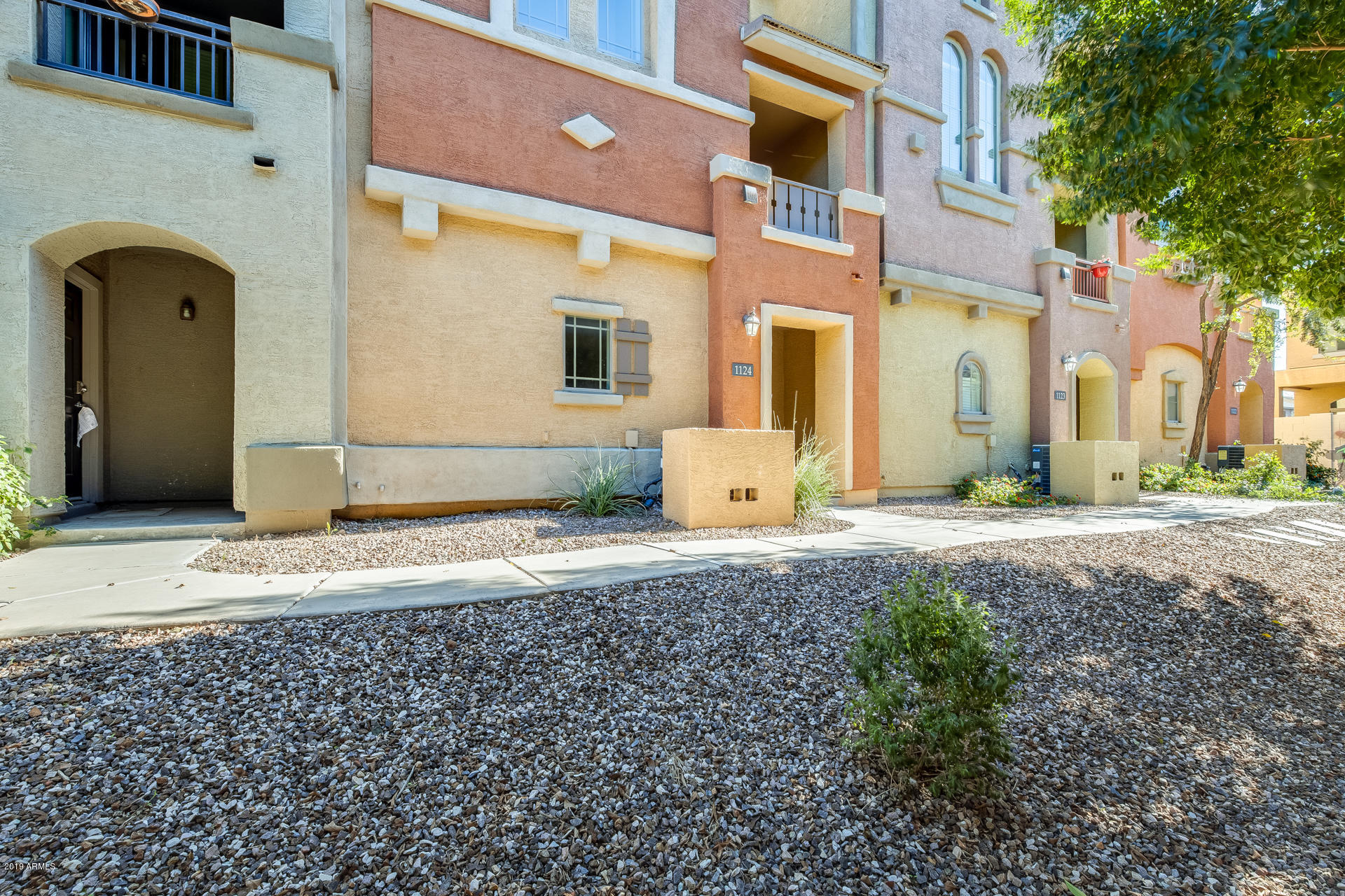 2401 East Rio Salado Parkway, Unit 1124 Tempe, AZ 85288 - Photo 6 of 32 a front view of a house with garden