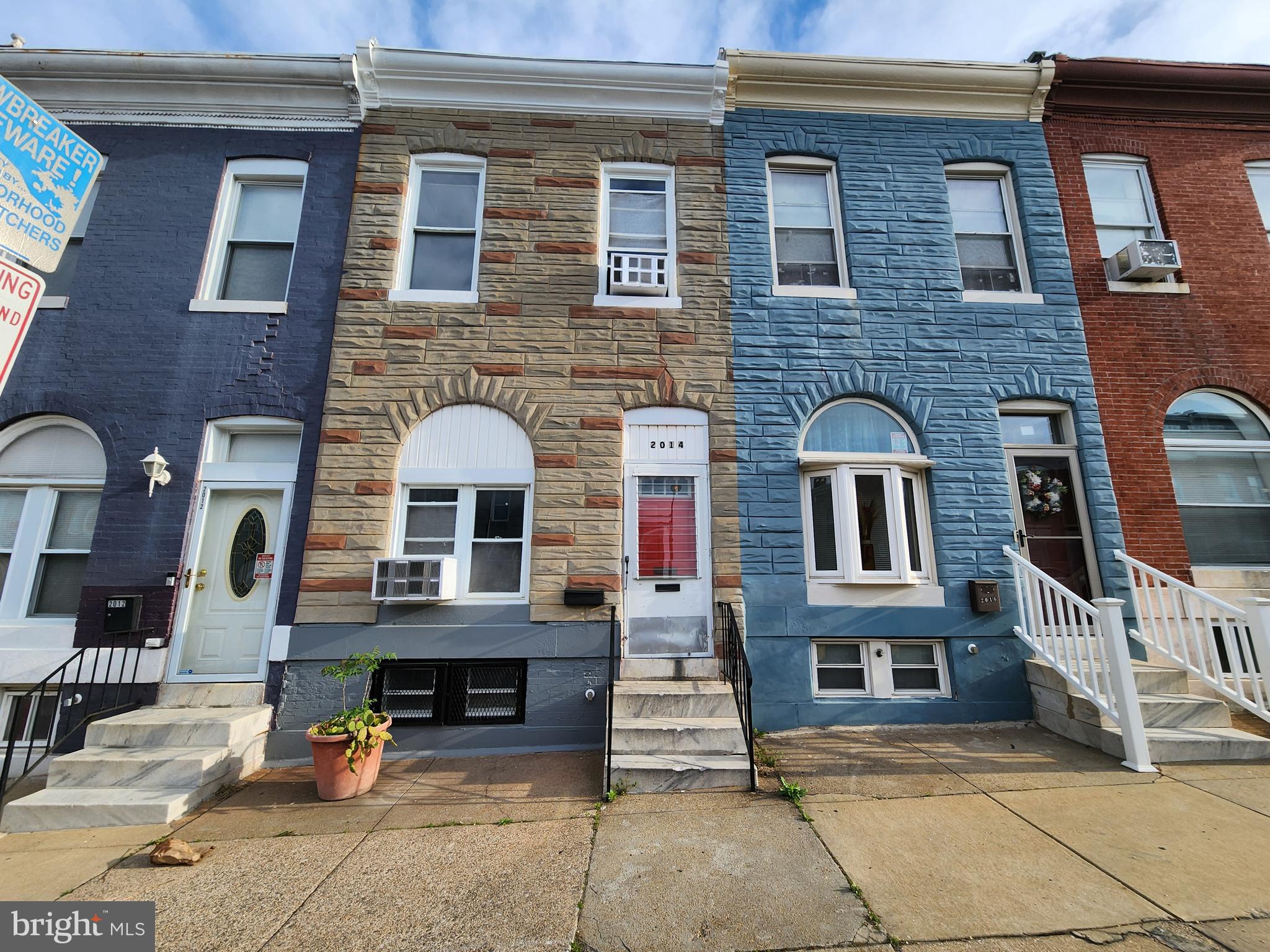 2014 East Lanvale Street Baltimore, MD 21213 - Photo 1 of 32 a front view of a house with parking