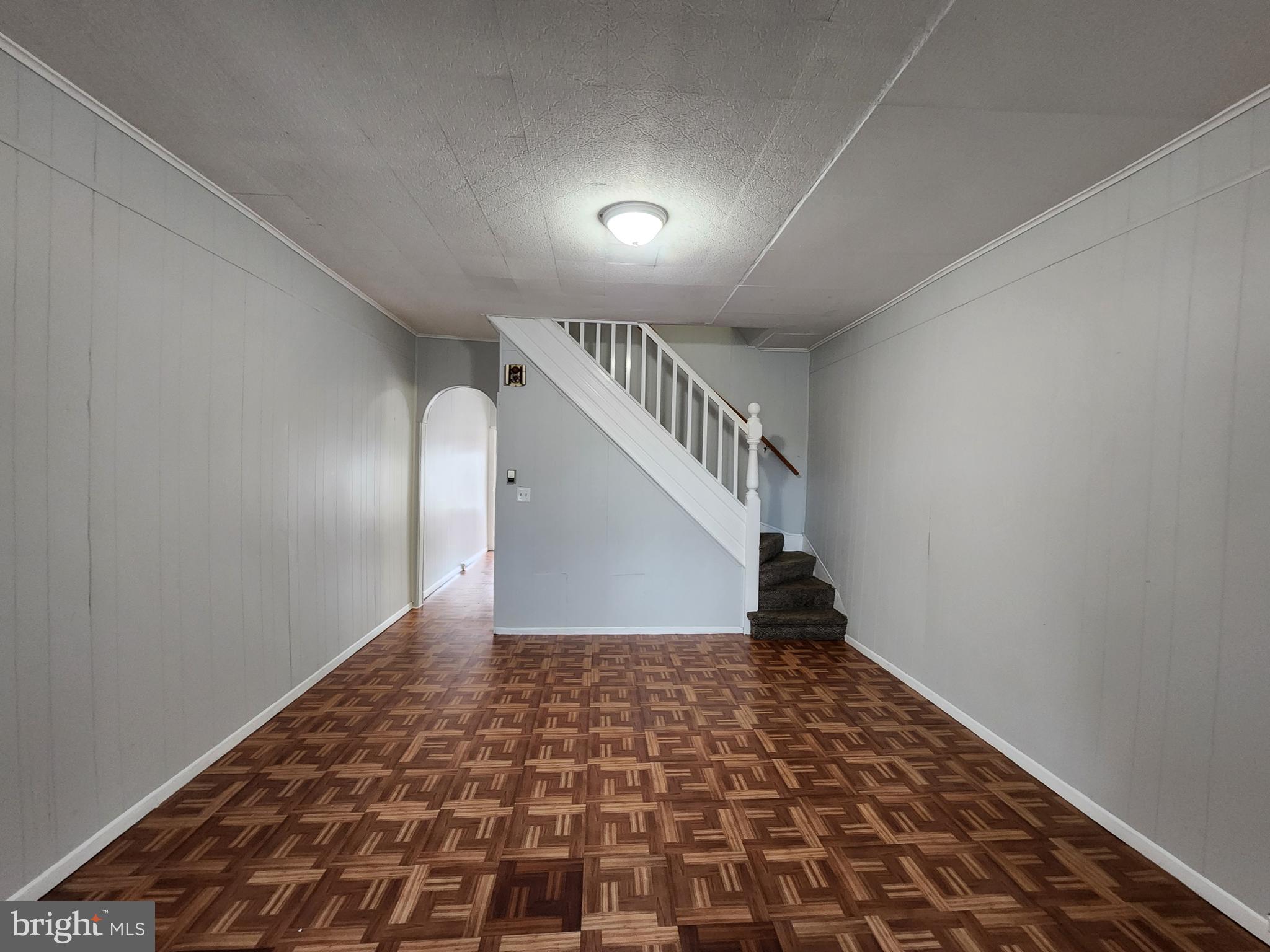 2014 East Lanvale Street Baltimore, MD 21213 - Photo 11 of 32 a view of a hallway with wooden floor