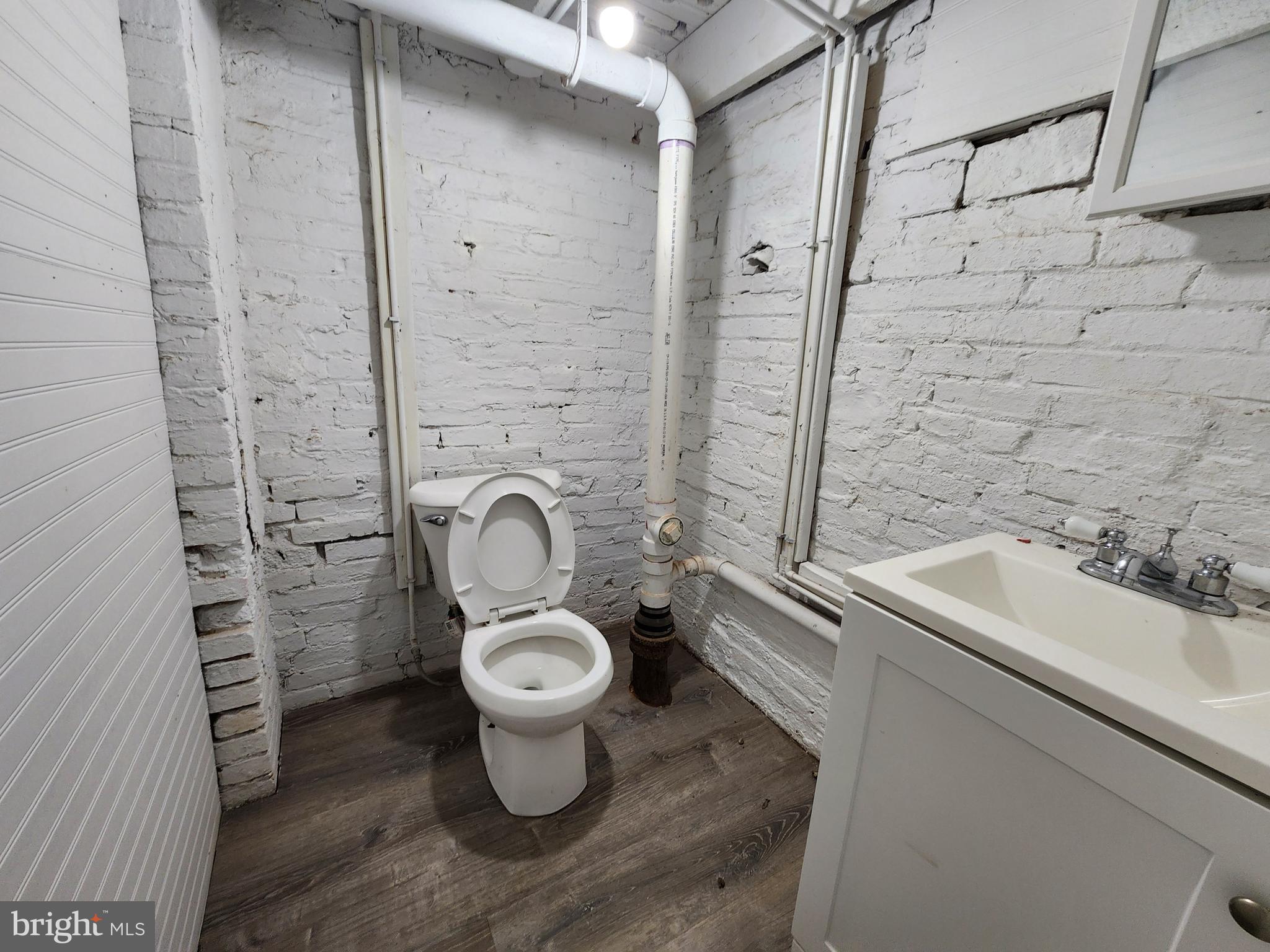 2014 East Lanvale Street Baltimore, MD 21213 - Photo 20 of 32 a bathroom with a sink toilet and shower