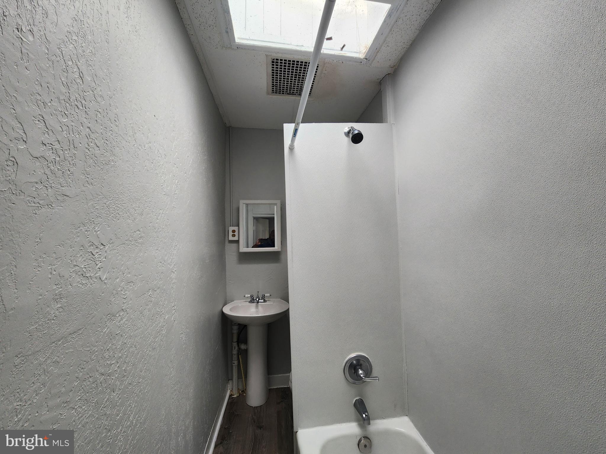 2014 East Lanvale Street Baltimore, MD 21213 - Photo 25 of 32 a bathroom with a sink and mirror