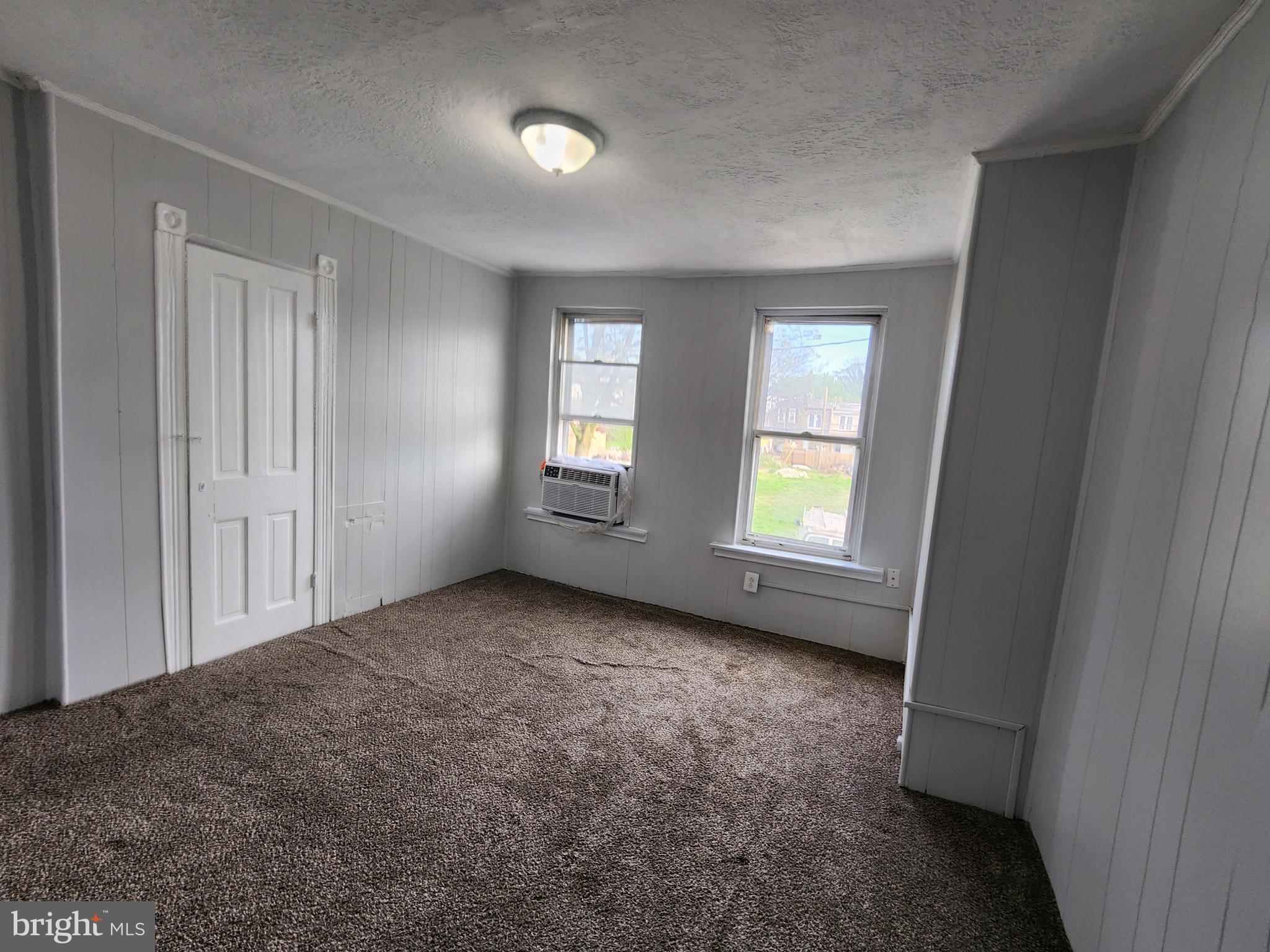 2014 East Lanvale Street Baltimore, MD 21213 - Photo 26 of 32 an empty room with windows