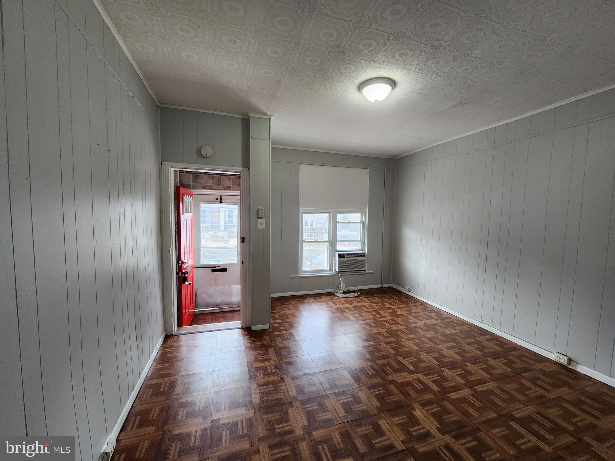 2014 East Lanvale Street Baltimore, MD 21213 - Photo 8 of 32 a view of an empty room with window and wooden floor