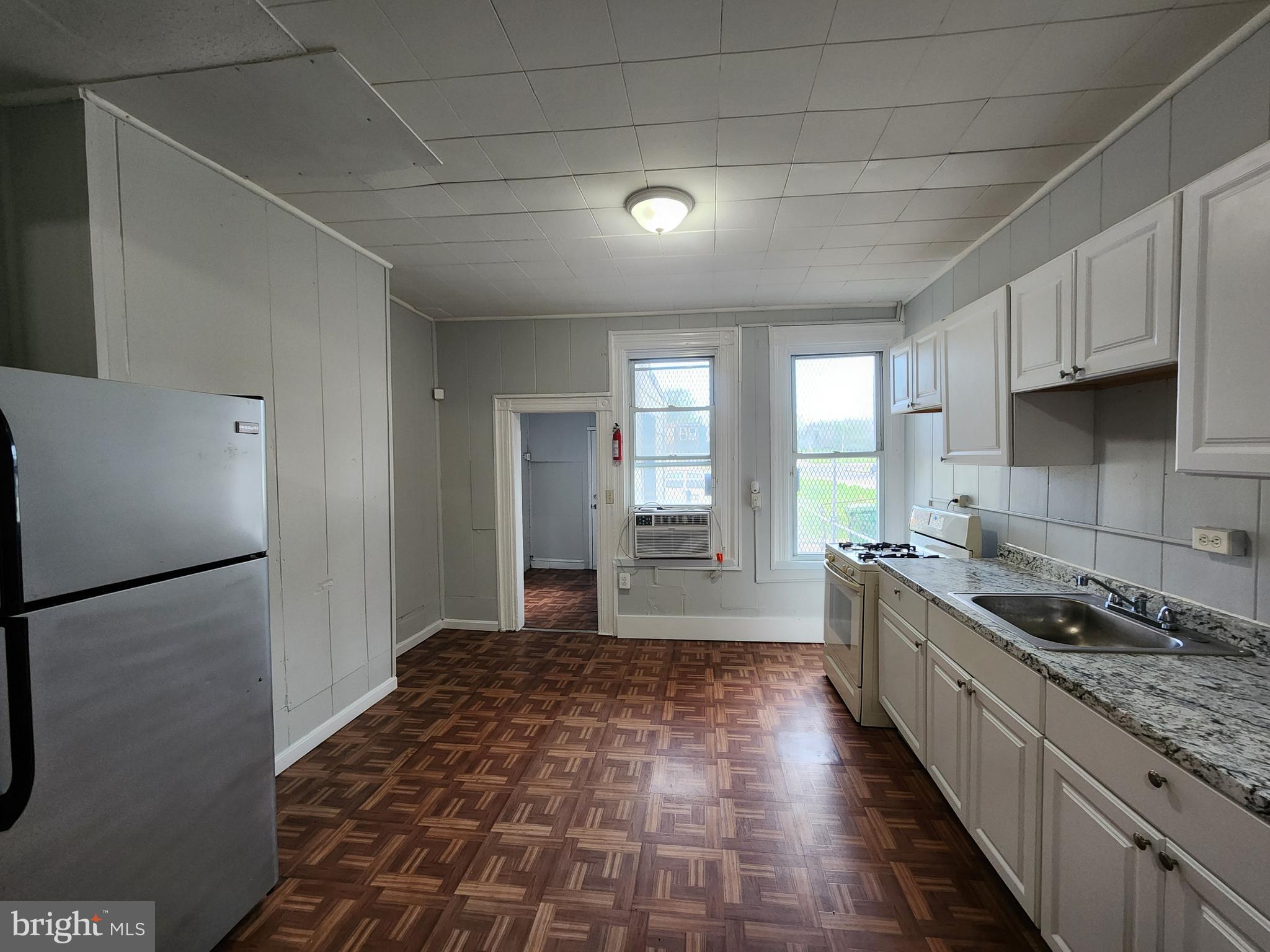 2014 East Lanvale Street Baltimore, MD 21213 - Photo 10 of 32 a kitchen with a stove a refrigerator and a sink