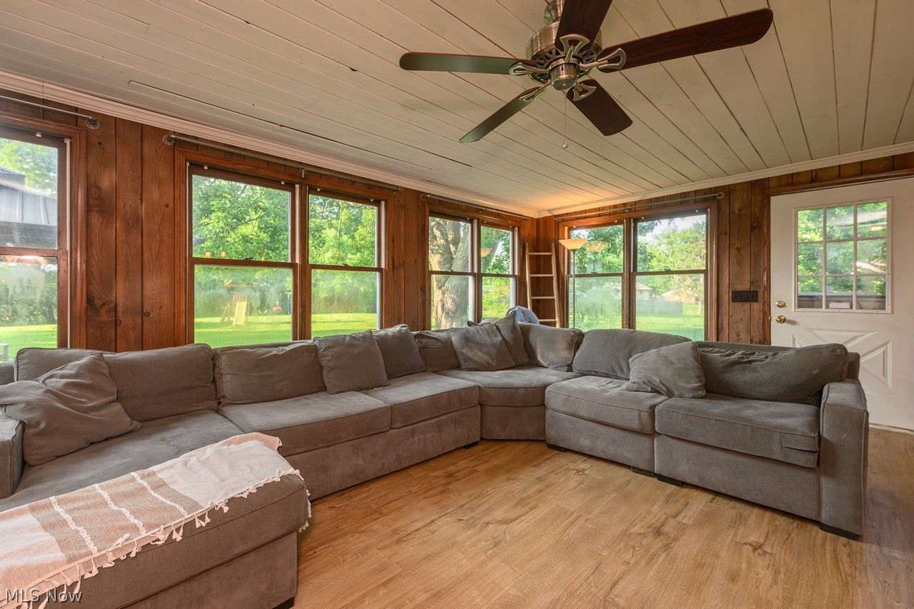 3912 Rolling Ridge Road Northeast Canton, OH 44721 - Photo 4 of 33 Awesome family room addition with tons of windows wood-burning stove and pine ceiling