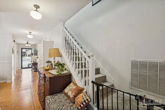 a view of a livingroom with furniture hardwood floor and a living room