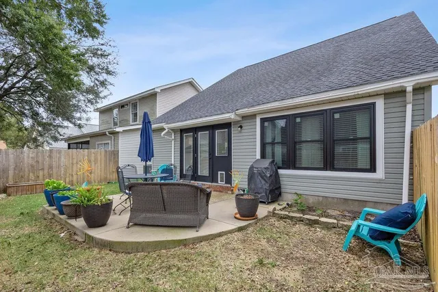 a view of a house with sitting area and furniture