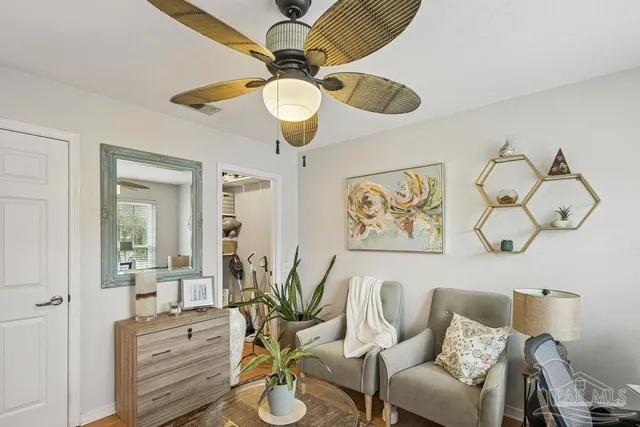 a view of dining room filled with furniture and chandelier