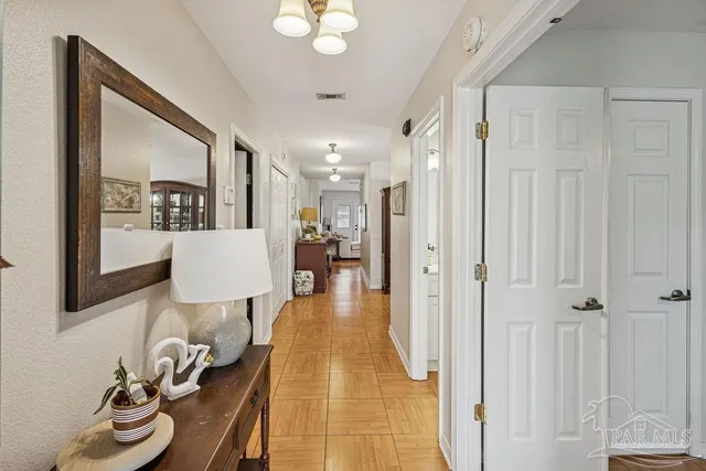 a bathroom with a sink mirror and vanity