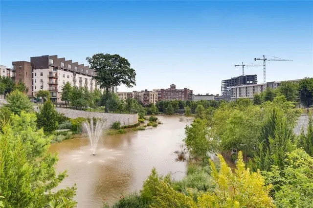 a view of a lake with a building in the background