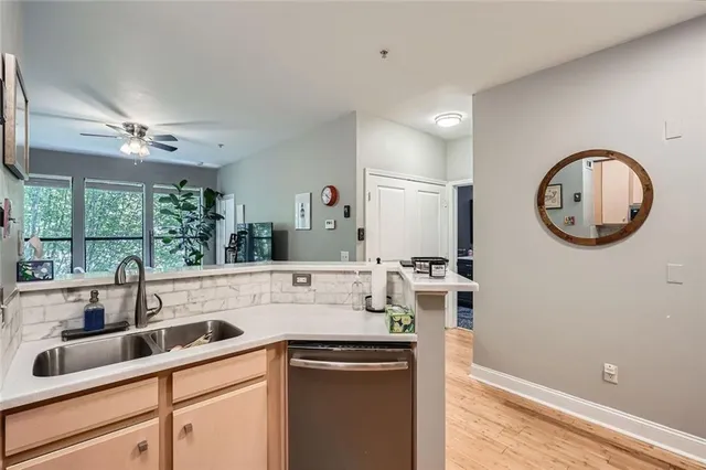 a kitchen with a sink and a refrigerator