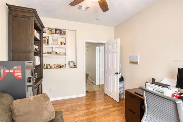 a view of kitchen with furniture and wooden floor