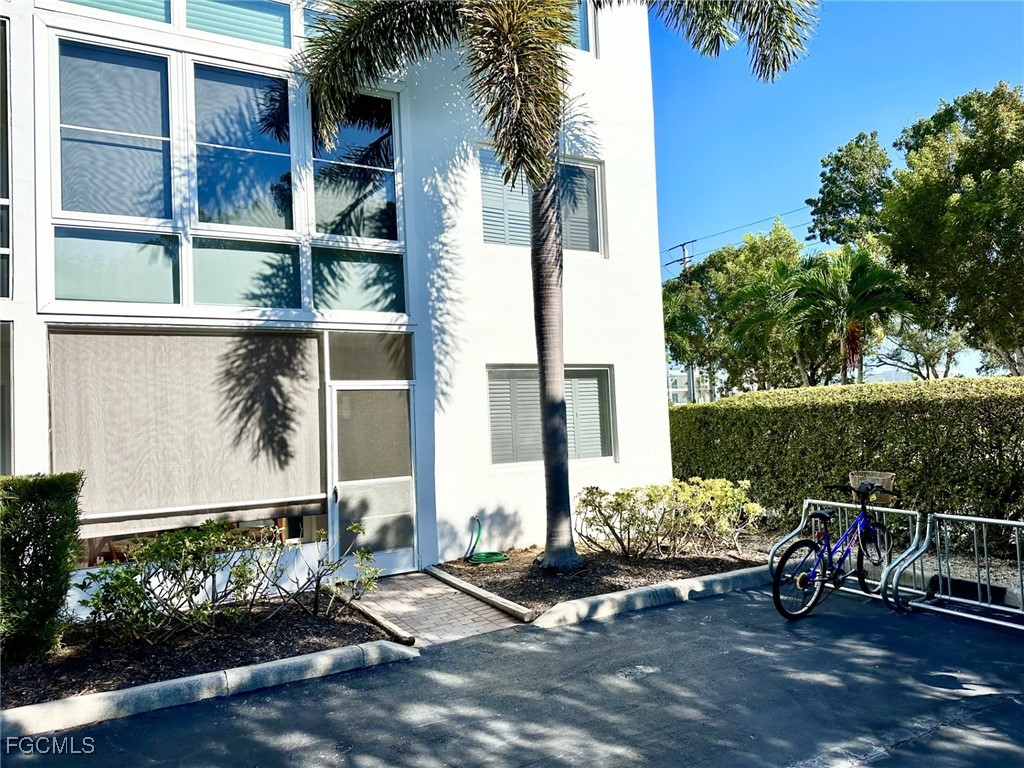 72 7th Street South, Unit 112 Naples, FL 34102 - Photo 19 of 28 a view of a chair and table in the terrace