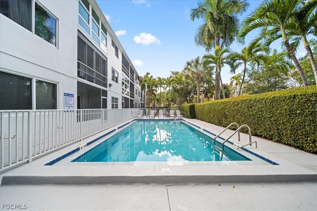 72 7th Street South, Unit 112 Naples, FL 34102 - Photo 21 of 28 a small pool with an outdoor space