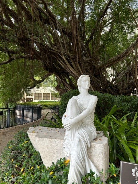 72 7th Street South, Unit 112 Naples, FL 34102 - Photo 28 of 28 a view of a chair and table in backyard