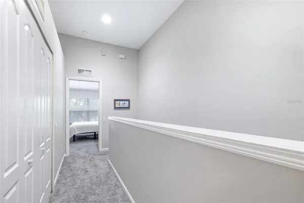 a bedroom with a bed and a desk