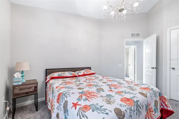 a bedroom with a bed and a table