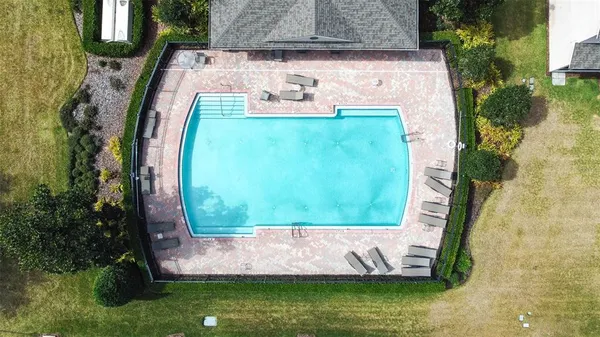 a aerial view of a house with a yard